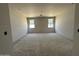 Bright bedroom with ample natural light and unfinished drywall, ready for customization at 22812 E Lords Way, Queen Creek, AZ 85142