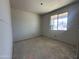 Unfinished bedroom with a large window providing natural light, awaiting personalization at 22812 E Lords Way, Queen Creek, AZ 85142
