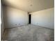 Bedroom featuring unfinished walls, a doorway, and ample space at 22812 E Lords Way, Queen Creek, AZ 85142