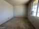 A room in an unfinished home with a single window at 22812 E Lords Way, Queen Creek, AZ 85142