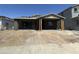Exterior of a home under construction with a two-car garage and a covered front porch at 22812 E Lords Way, Queen Creek, AZ 85142