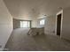Spacious great room featuring sliding glass doors and ample natural light at 22812 E Lords Way, Queen Creek, AZ 85142