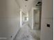 Unfinished hallway showcasing the spacious layout of the home under construction at 22812 E Lords Way, Queen Creek, AZ 85142