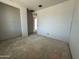 Spacious room with open doorways, ready for customization and personalization in a new home at 22812 E Lords Way, Queen Creek, AZ 85142