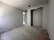 Unfinished room showcasing an open layout and closet, ready for customization in a new home at 22812 E Lords Way, Queen Creek, AZ 85142