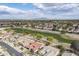 Stunning aerial view of a vibrant residential community near a lush golf course at 2394 E Santiago Trl, Casa Grande, AZ 85194