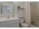 Clean bathroom featuring a sink, toilet, shower, and vanity with ample storage space at 2394 E Santiago Trl, Casa Grande, AZ 85194