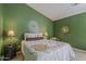 Charming bedroom with a decorative bed, green walls, and unique decor at 2394 E Santiago Trl, Casa Grande, AZ 85194