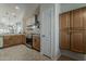 Spacious kitchen with stainless steel appliances, ample cabinet space, and open floor plan to living area at 2394 E Santiago Trl, Casa Grande, AZ 85194