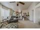 Bright and airy living room with an open floor plan, high ceilings, and easy access to the kitchen at 2394 E Santiago Trl, Casa Grande, AZ 85194