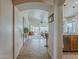 Open floor plan hallway with a view to the living room, dining area, and outdoor space at 2394 E Santiago Trl, Casa Grande, AZ 85194