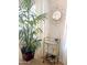 Bright living room with a decorative cart, gold geometric mirror, house plant, and neutral curtains at 2394 E Santiago Trl, Casa Grande, AZ 85194
