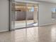 Sliding glass doors open to a covered back patio and construction of backyard at 2530 N Pony Ln, Casa Grande, AZ 85122