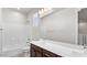 Bright bathroom with double sink vanity, tub, and shower with white tile surround at 2530 N Pony Ln, Casa Grande, AZ 85122
