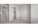 Bedroom with neutral carpet, closet, and door leading to the hall at 2530 N Pony Ln, Casa Grande, AZ 85122