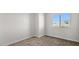 Bedroom with neutral carpet, a window with blinds, and fresh paint at 2530 N Pony Ln, Casa Grande, AZ 85122
