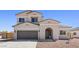 Charming two-story home with a two-car garage and low-maintenance desert landscaping at 2530 N Pony Ln, Casa Grande, AZ 85122