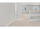 Bright hallway with neutral carpet and natural light from windows in a modern home at 2530 N Pony Ln, Casa Grande, AZ 85122