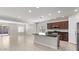 Open-concept kitchen with a large island, stainless steel appliances, and ample counter space at 2530 N Pony Ln, Casa Grande, AZ 85122