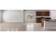 Open floorplan with living room and view of kitchen with granite counters at 2530 N Pony Ln, Casa Grande, AZ 85122