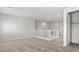 Open loft area with neutral carpet, white railing and plenty of light in new home at 2530 N Pony Ln, Casa Grande, AZ 85122