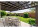 Spacious backyard with a well-maintained lawn, patio, and comfortable outdoor seating area at 26733 W Melinda Ln, Buckeye, AZ 85396