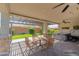 Inviting covered patio with outdoor seating and a relaxing hot tub, perfect for entertaining at 26733 W Melinda Ln, Buckeye, AZ 85396