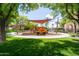 Charming community playground with shade structures, play equipment, and inviting green space for Gathering fun at 26733 W Melinda Ln, Buckeye, AZ 85396