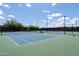 Inviting tennis courts with nets and a covered bench, perfect for enjoying a match under the open sky at 26733 W Melinda Ln, Buckeye, AZ 85396