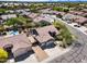 High aerial showcasing home's landscaped yard, proximity to neighboring houses, and the street at 29023 N 48Th Ct, Cave Creek, AZ 85331