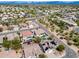 Panoramic aerial view captures a neighborhood of single-Gathering homes with pools and mountain views at 29023 N 48Th Ct, Cave Creek, AZ 85331