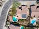An aerial view shows a private backyard pool and spa with desert landscaping and a patio for entertaining at 29023 N 48Th Ct, Cave Creek, AZ 85331