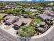 Aerial view of a home showcasing lush landscaping, a refreshing pool, and the surrounding neighborhood at 29023 N 48Th Ct, Cave Creek, AZ 85331
