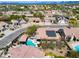 Expansive aerial view of a community showcasing well-maintained homes, desert landscaping, and a community pool at 29023 N 48Th Ct, Cave Creek, AZ 85331