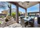 Outdoor living space features an inviting patio, dining area, a pool, and landscaped backyard at 29023 N 48Th Ct, Cave Creek, AZ 85331