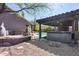 Desert backyard with a private pool, hot tub, outdoor kitchen and lounging areas at 29023 N 48Th Ct, Cave Creek, AZ 85331