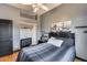 Bedroom featuring hardwood floors, neutral-colored walls, and a television, creating a relaxing and private space at 29023 N 48Th Ct, Cave Creek, AZ 85331