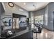 Modern kitchen with sleek black cabinetry, granite countertops, and stainless steel appliances at 29023 N 48Th Ct, Cave Creek, AZ 85331