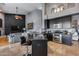 Well-appointed kitchen with stainless steel appliances, black cabinetry, and island seating at 29023 N 48Th Ct, Cave Creek, AZ 85331