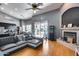 Bright living area with open layout, fireplace, dining area, and sliding glass doors to the outside at 29023 N 48Th Ct, Cave Creek, AZ 85331