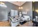 Stylish living room with modern white sofas, chess table, and natural light at 29023 N 48Th Ct, Cave Creek, AZ 85331