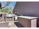 Outdoor kitchen featuring stainless steel grill, countertop prep area, and built-in features at 29023 N 48Th Ct, Cave Creek, AZ 85331
