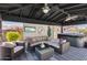 Covered outdoor living area featuring comfortable seating, ceiling fans, and a hot tub at 29023 N 48Th Ct, Cave Creek, AZ 85331