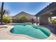 Backyard pool with desert landscaping and a covered patio, perfect for outdoor living at 29023 N 48Th Ct, Cave Creek, AZ 85331