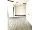 Bright and airy living room with wood-look tiled flooring and a closet space at 2925 N 19Th Ave # 97, Phoenix, AZ 85015