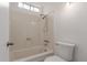 Bathroom with a standard tub and shower combination and a white toilet at 3030 W Christy Dr, Phoenix, AZ 85029