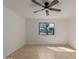 Bedroom with tile flooring, a ceiling fan, and a window with natural light and outside view at 3030 W Christy Dr, Phoenix, AZ 85029