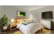 Comfortable bedroom with hardwood floors, a decorative rug, and TV at 3030 W Christy Dr, Phoenix, AZ 85029
