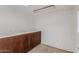 Spacious bonus room with cabinet storage; ideal for hobbies, home office, or recreation at 3030 W Christy Dr, Phoenix, AZ 85029