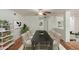 Dining room features a long black table, seating for eight, and tiled floors at 3030 W Christy Dr, Phoenix, AZ 85029